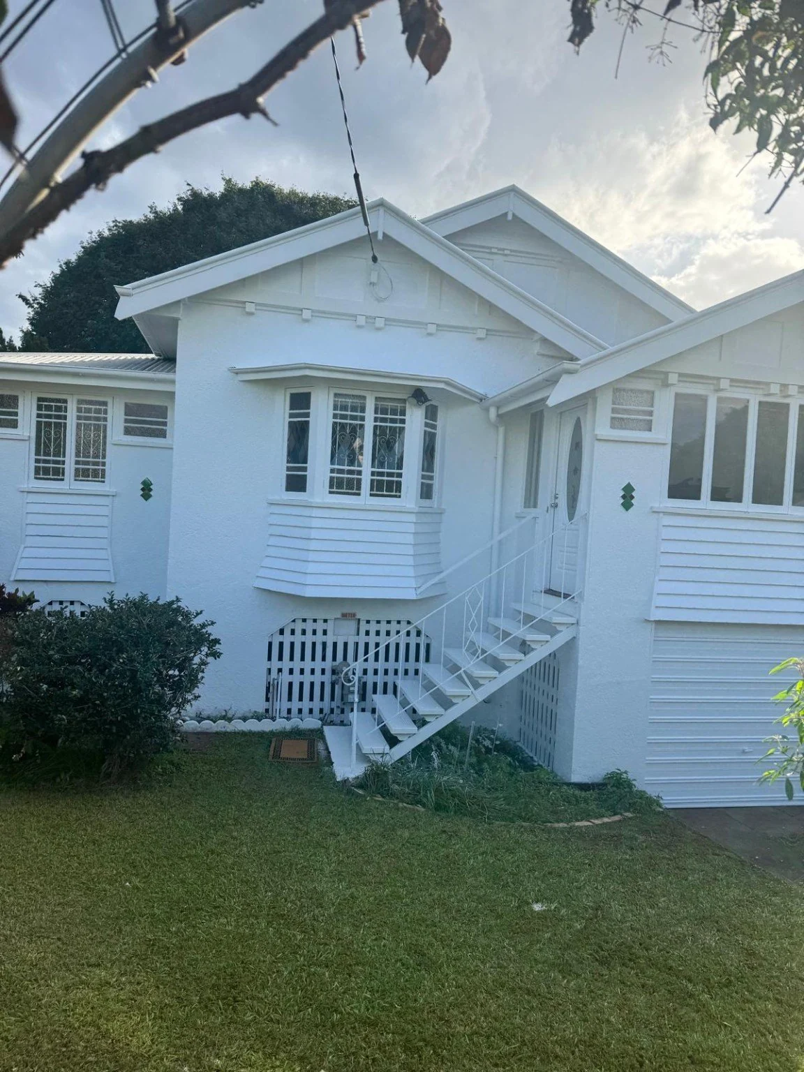 White weatherboard home after exterior painting